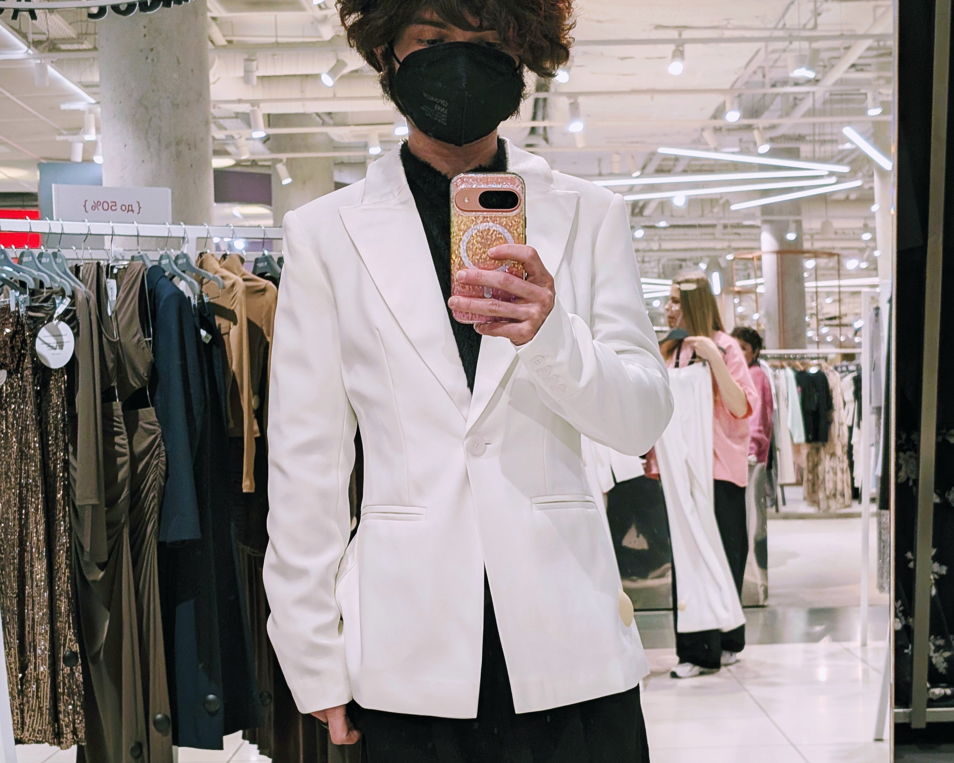 Fitting room mirror selfie wearing the white designer jacket in Moscow
